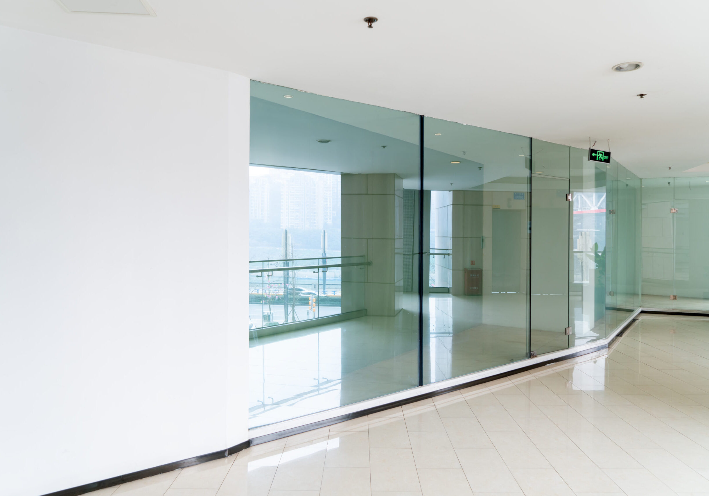 A modern office building with glass doors and windows